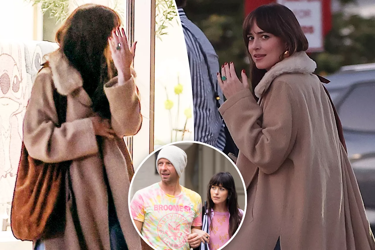 Dakota Johnson flashes massive emerald engagement ring at paparazzi after shutting down Chris Martin split rumors