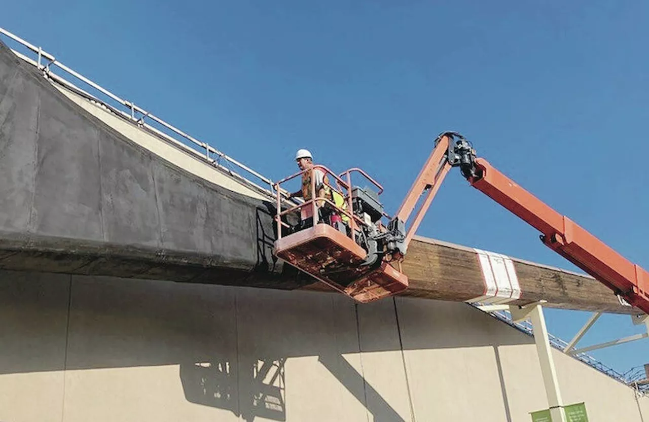 Workers explore giant hockey stick before removal; there might be a time capsule