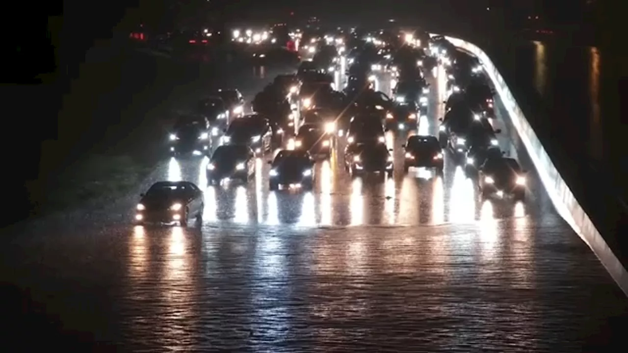 Drivers left stranded as flooding on roads swallow cars