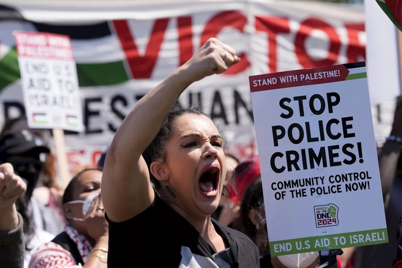 Protesters break through police fence near site of Democratic National Convention