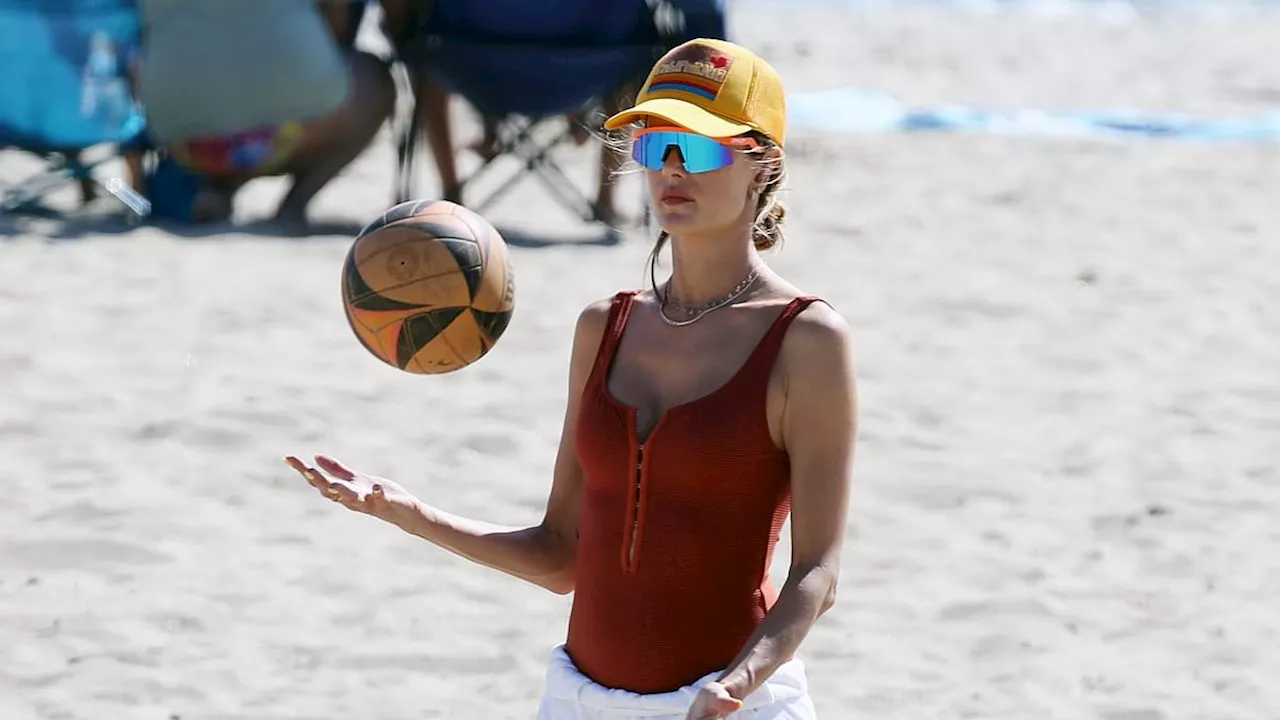 Alessandra Ambrosio showcases her fit form in burnt orange bathing suit as she arrives for a beach...