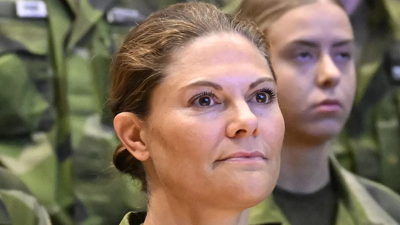 Crown Princess Victoria of Sweden dons camouflage as she begins training to become a special officer...