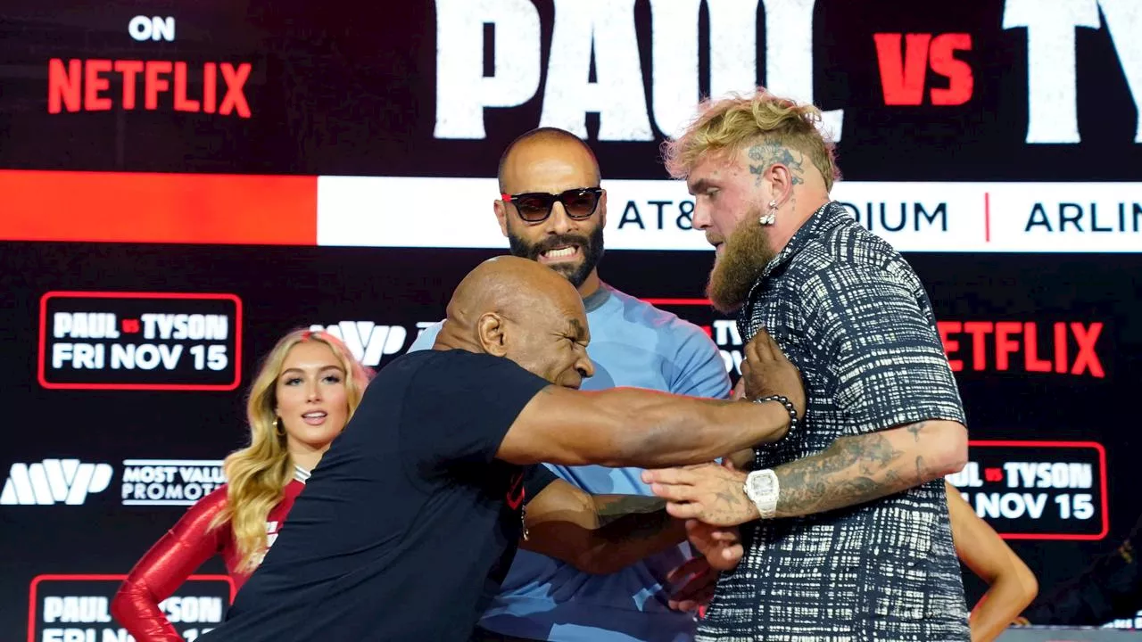 Jake Paul ruthlessly booed, Tyson gets physical as rivals reunite before postponed fight