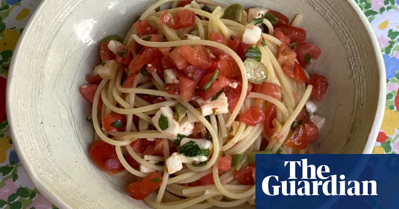 Rachel Roddy’s recipe for pasta with a raw tomato, mozzarella, herb and olive sauce