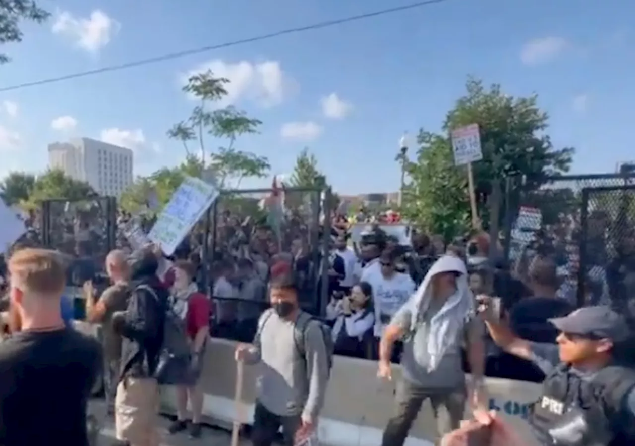 DNC: Protesters Breaching Fence, Cops Donning Helmets and Gas Masks