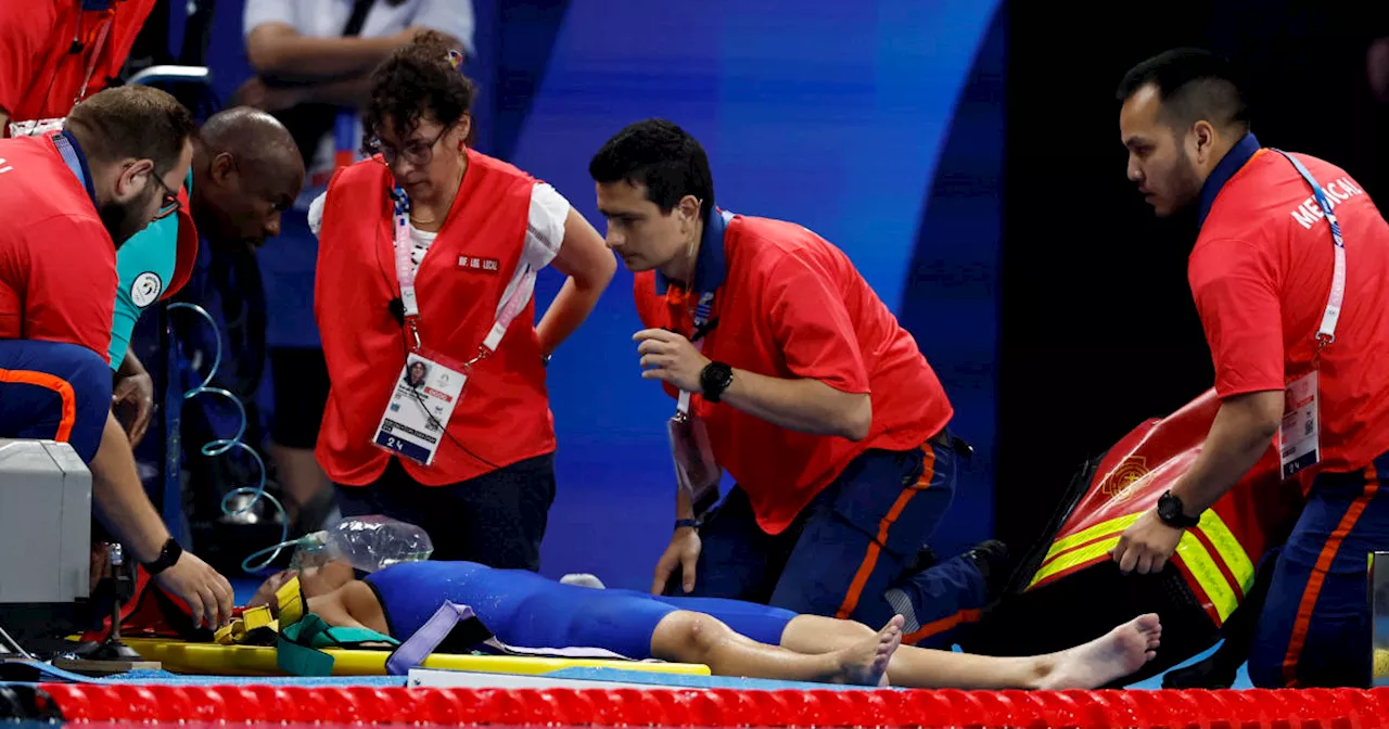 Olympic swimmer Tamara Potocka collapses poolside after women's 200-meter race