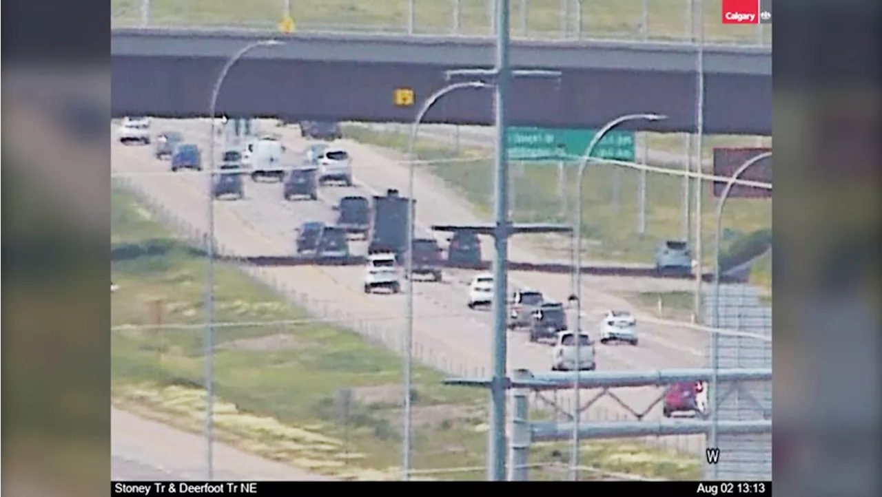 Wheel falls off trailer on Stoney Trail, striking windshield