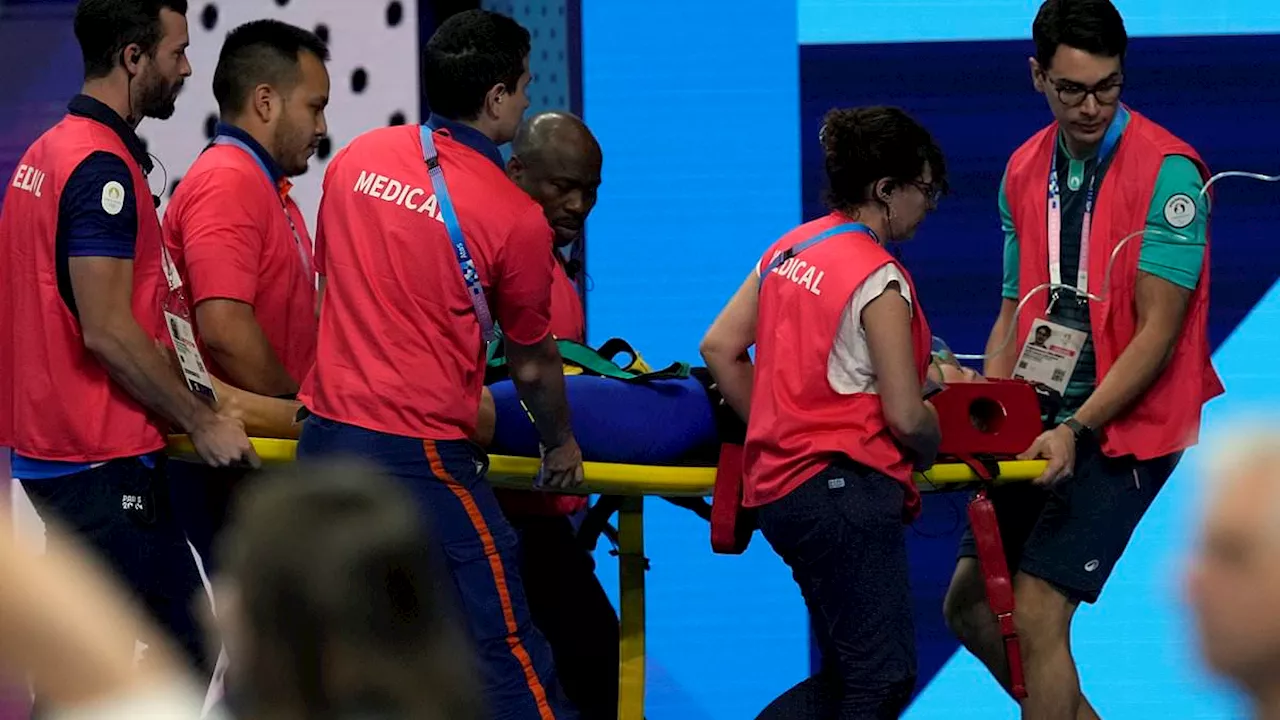 Slovakian swimmer Tamara Potocka, 21, collapses and is taken away on a stretcher in front of...