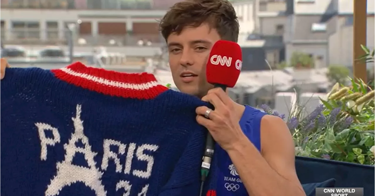 Olympic medalist Tom Daley unveils his latest achievement: A sweater, knitted poolside