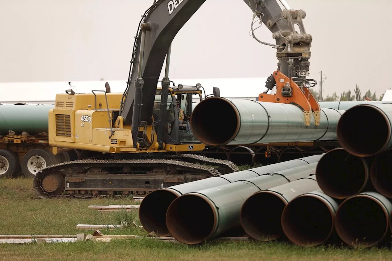 Enbridge makes progress on utility purchases; raises earnings forecast