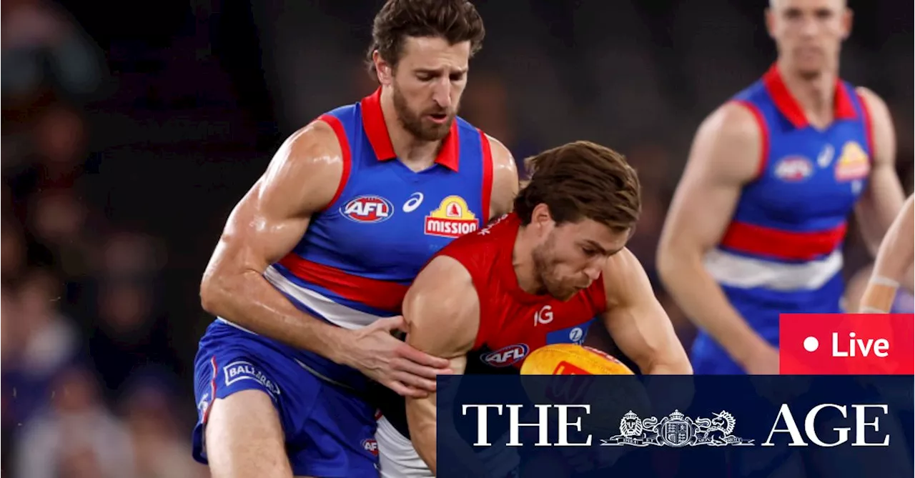 AFL Live: Injury scare for key defender as Demons claw their way back