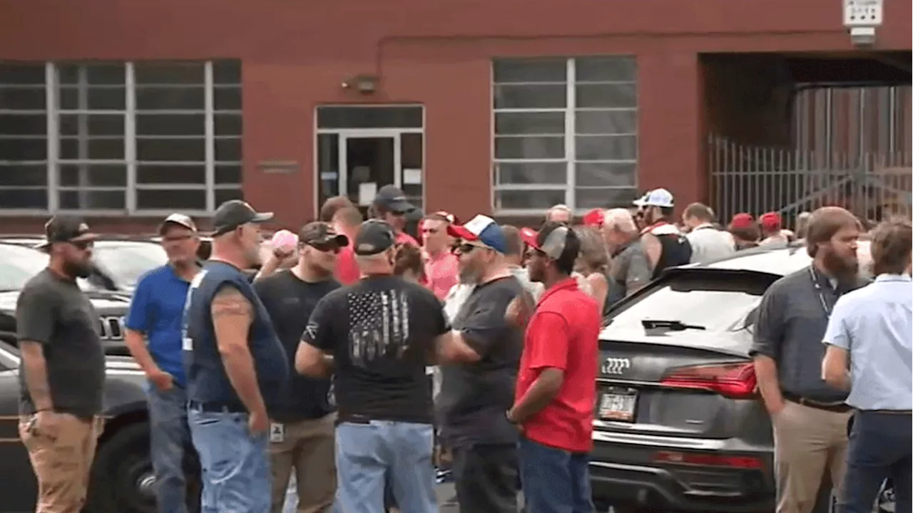 Dozens of former President Donald Trump's supporters gathered outside his rally in York