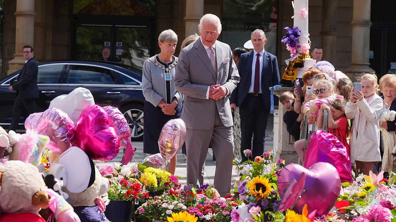 King arrives in Southport to meet stabbing attack survivors: Charles inspects sea of floral tributes...