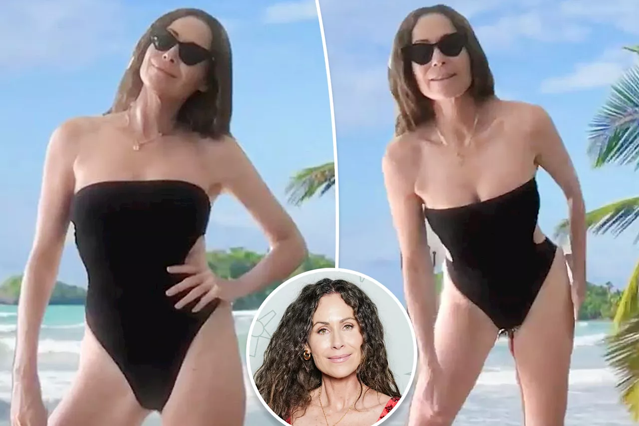 Minnie Driver models strapless cutout swimsuit in green-screen beach photo: 'Questioning my sanity'