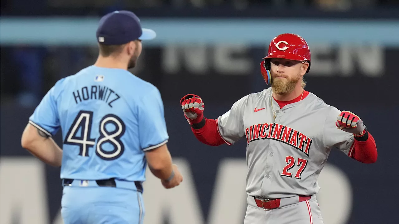 Reds score four in sixth-inning outburst, roll past Blue Jays