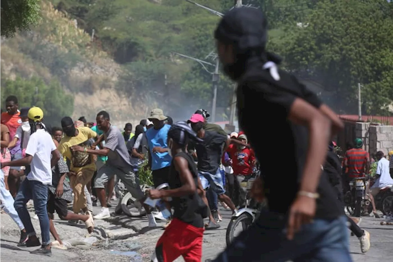 Haitian police tear-gas peaceful protesters as they demand help in stopping gangs