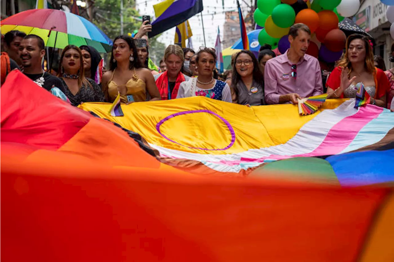 Same-sex couples and LGBTQ+ activists rally in Nepal's capital during the annual Pride parade