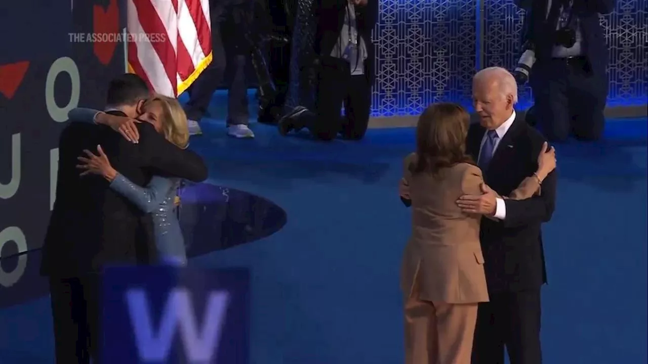 Biden gets emotional ovation, joined by family, Harris and Emhoff