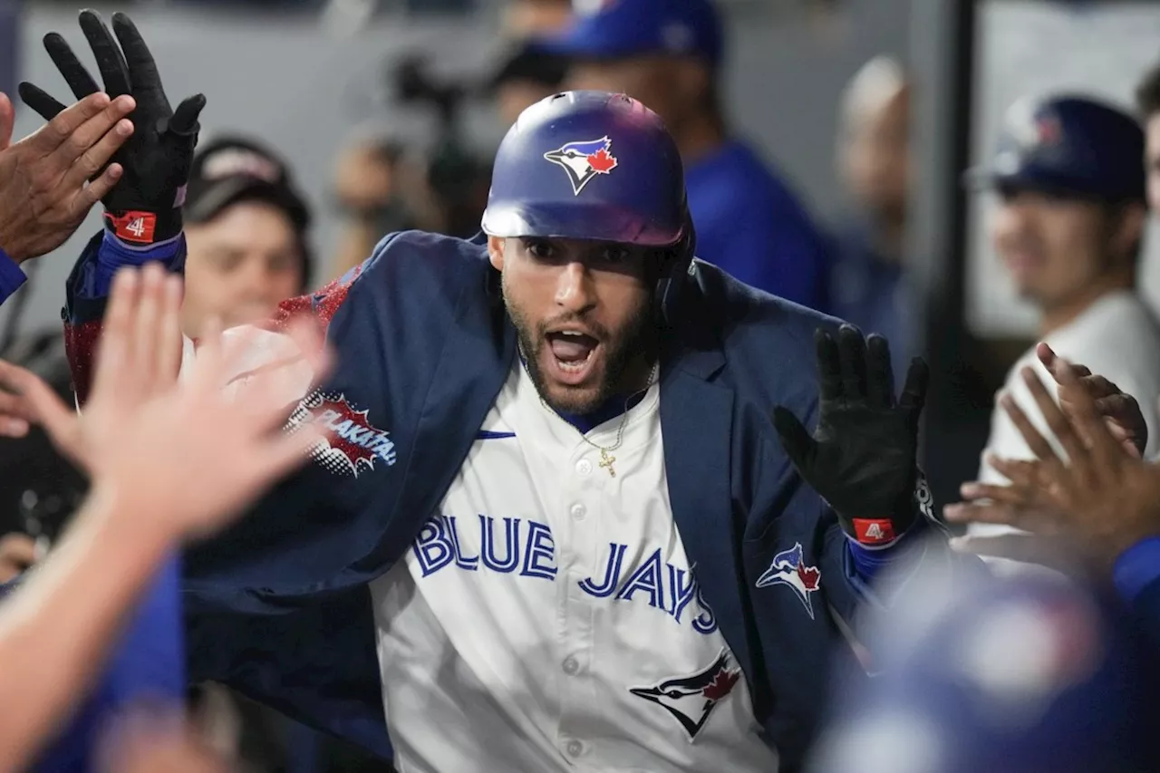 Springer helps homer-happy Blue Jays rout Reds 10-3