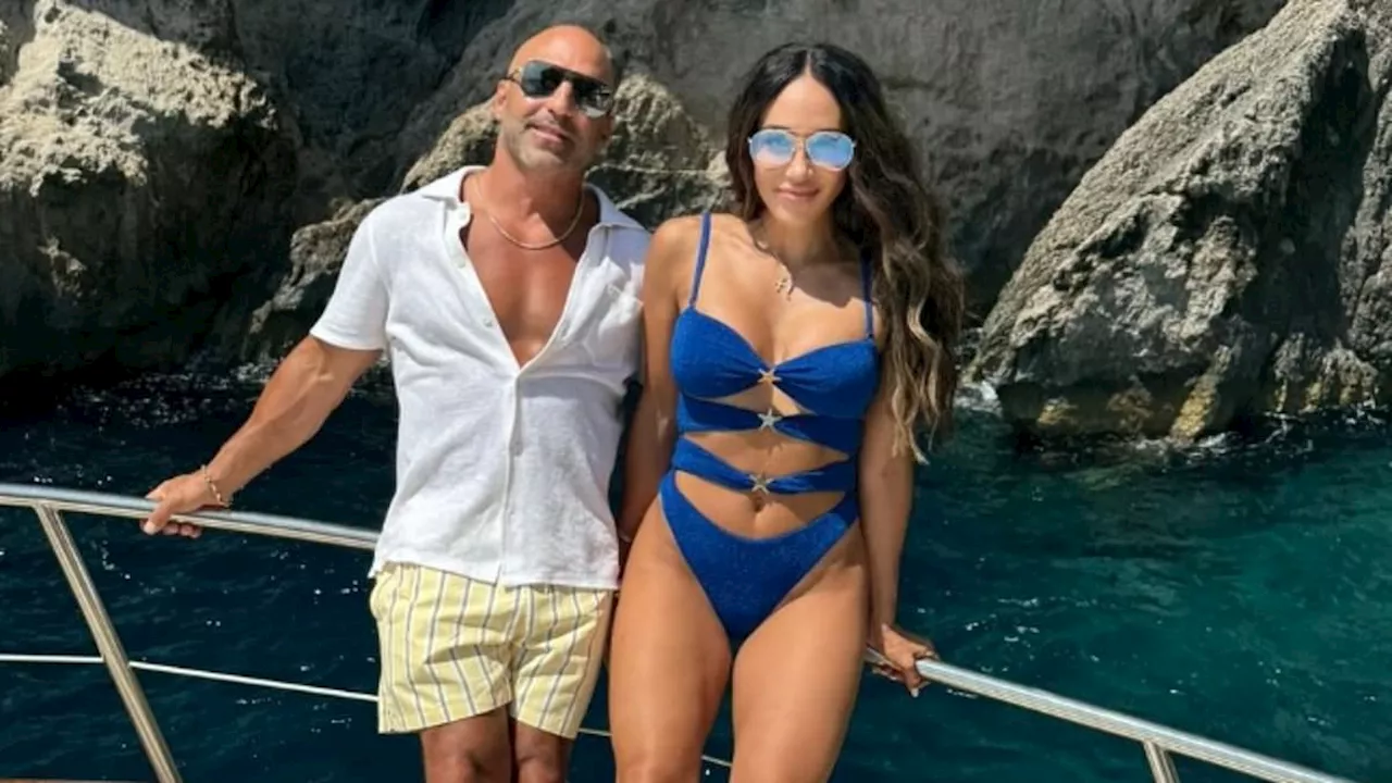 Melissa Gorga, 45, poses in a cut-out swimsuit as she wishes 'amazing' husband Joe a happy 50th...