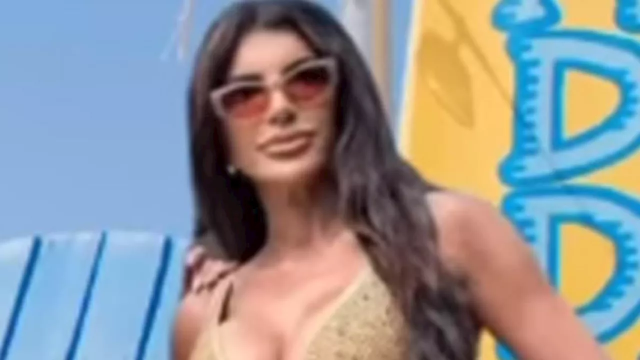 Teresa Giudice, 52, teases 'haters' by using THAT gold swimsuit photo again that created 1K memes......