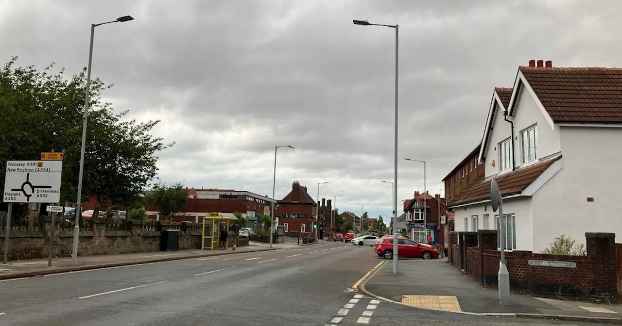 Busy main road closed as man hit by car