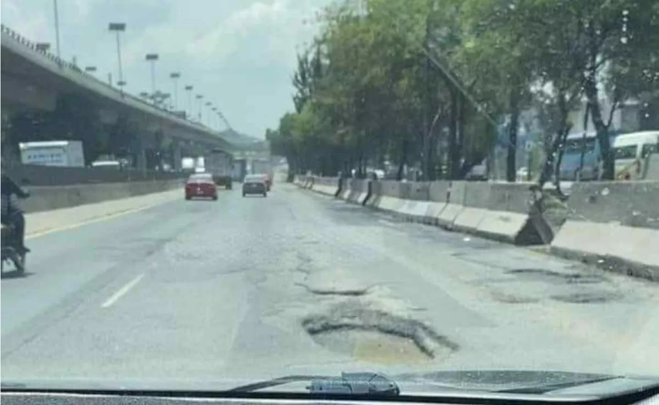 Automovilistas piden reparación de bache en carriles centrales de la México-Querétaro