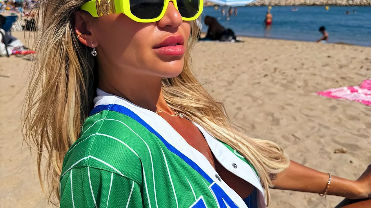 Christine McGuinness flashes her boobs beneath open shirt on the beach after hinting she’s found love a...