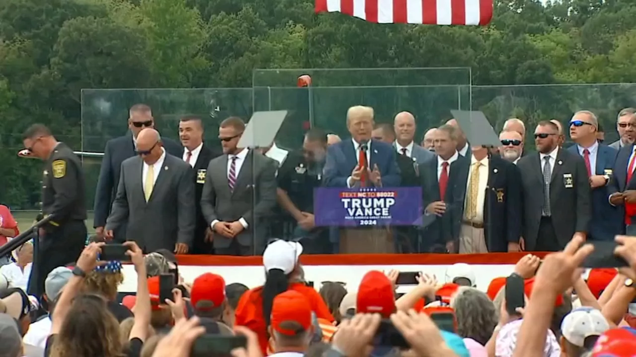 Trump speaks from behind bulletproof glass at 1st outdoor rally since assasination attempt