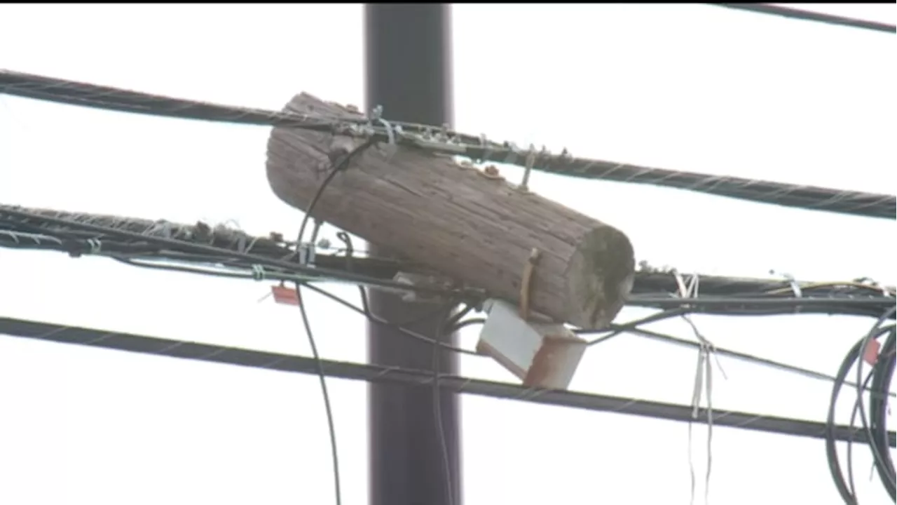 ‘It does not look very comforting’: Students concerned about piece of power pole hanging above busy intersection