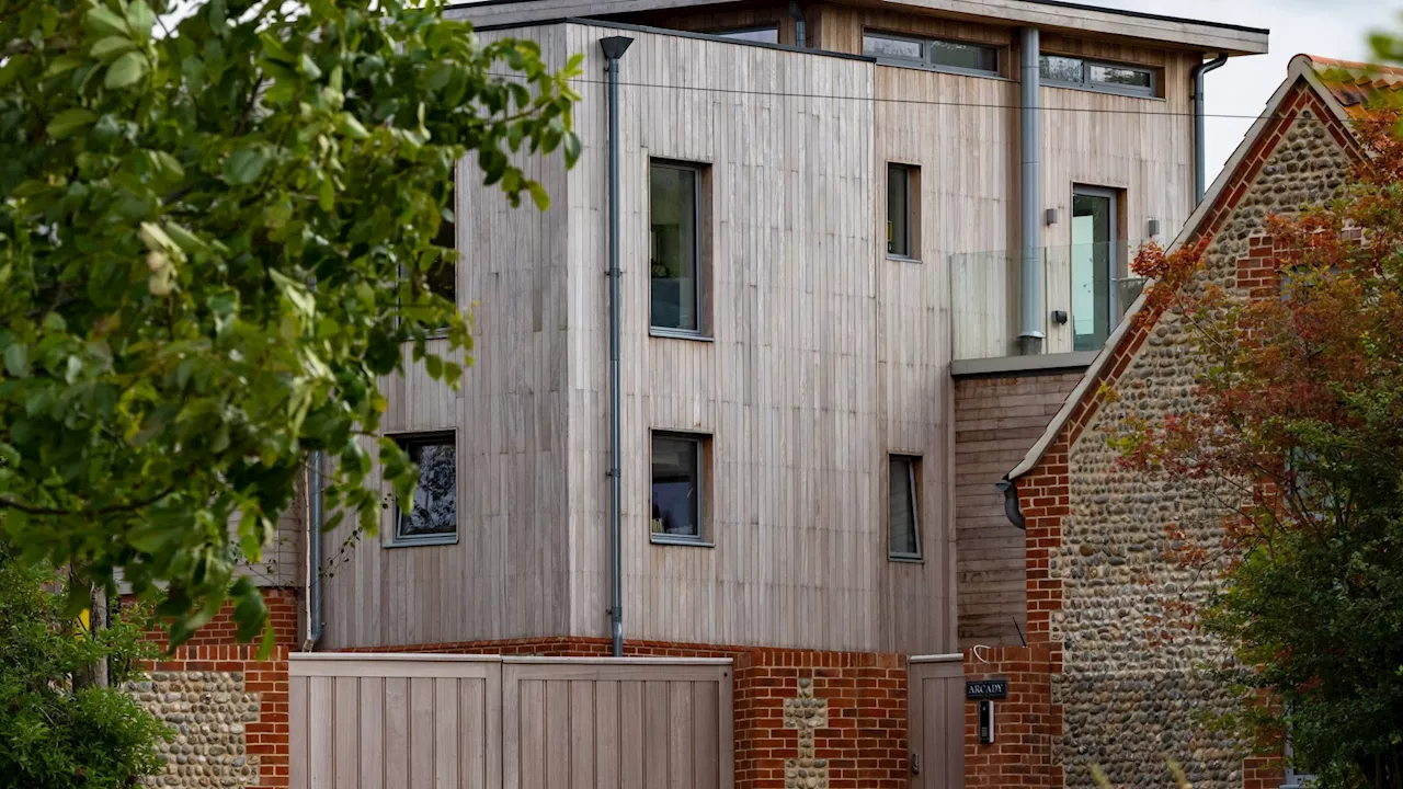 Our neighbour built a ‘dystopian castle’ so tall it’s looming over seaside homes