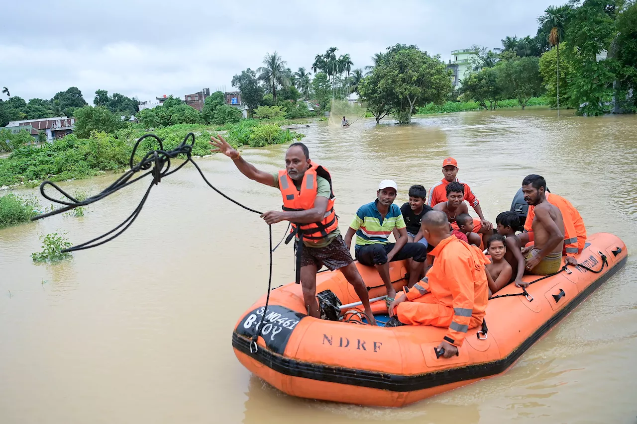 Floods maroon many people in Bangladesh and India and cause at least 15 deaths