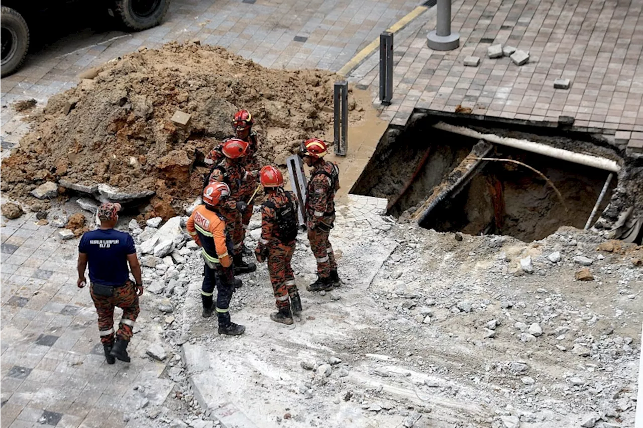 Strong current hampering efforts to rescue woman who fell into sinkhole in Kuala Lumpur