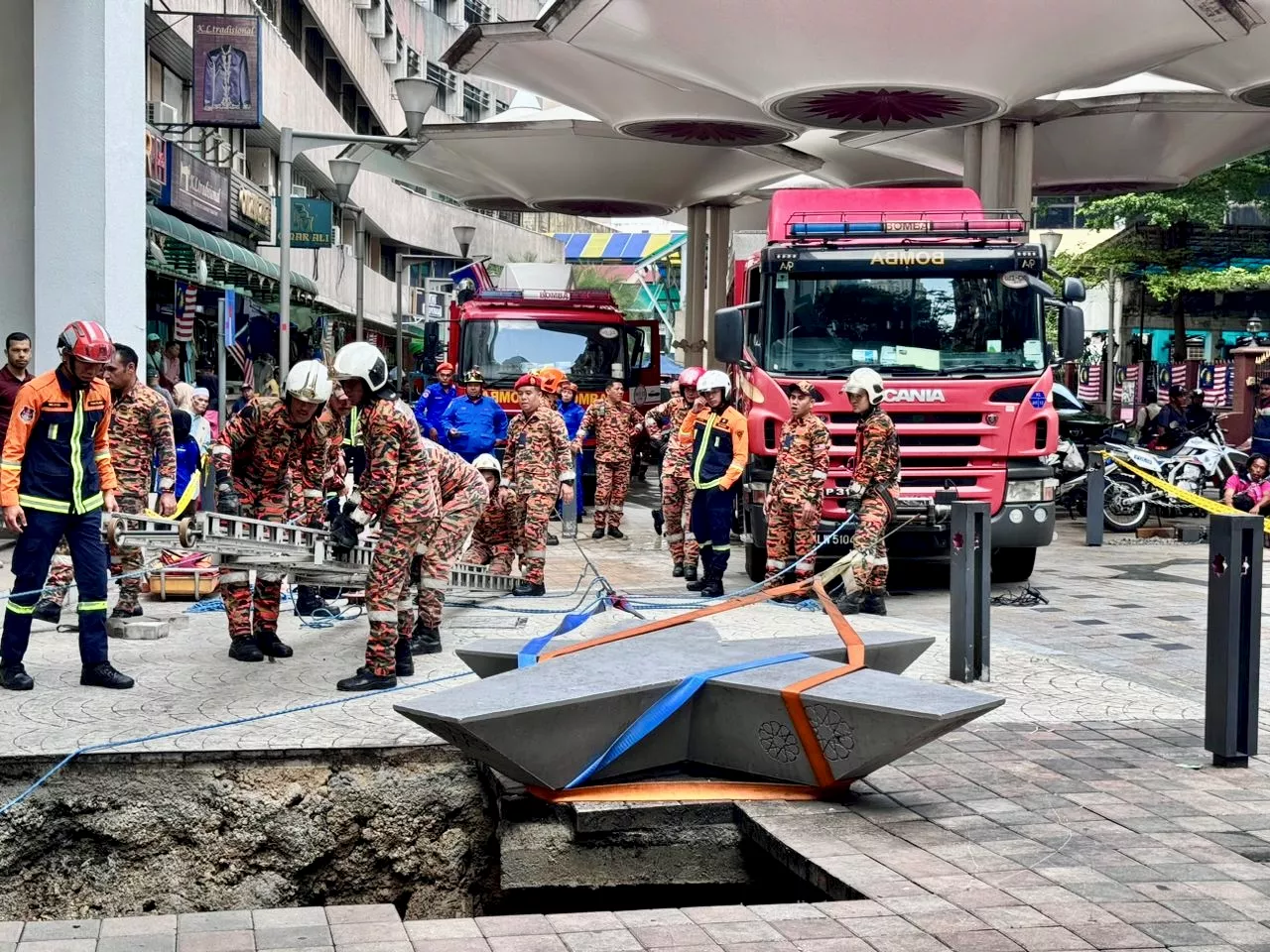 Sinkhole Opens In Heart Of KL, Rescue Underway For Trapped Woman