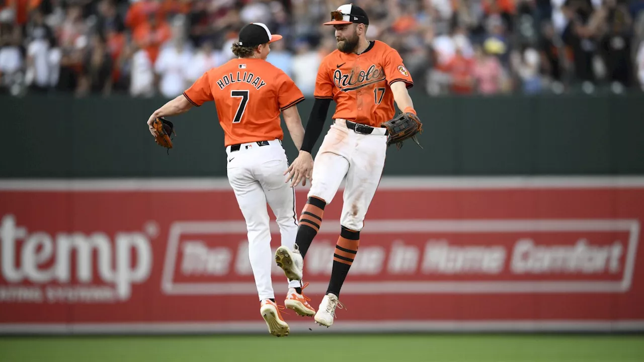 Hustle and Holliday. That winning combination gave the Orioles a second straight comeback victory