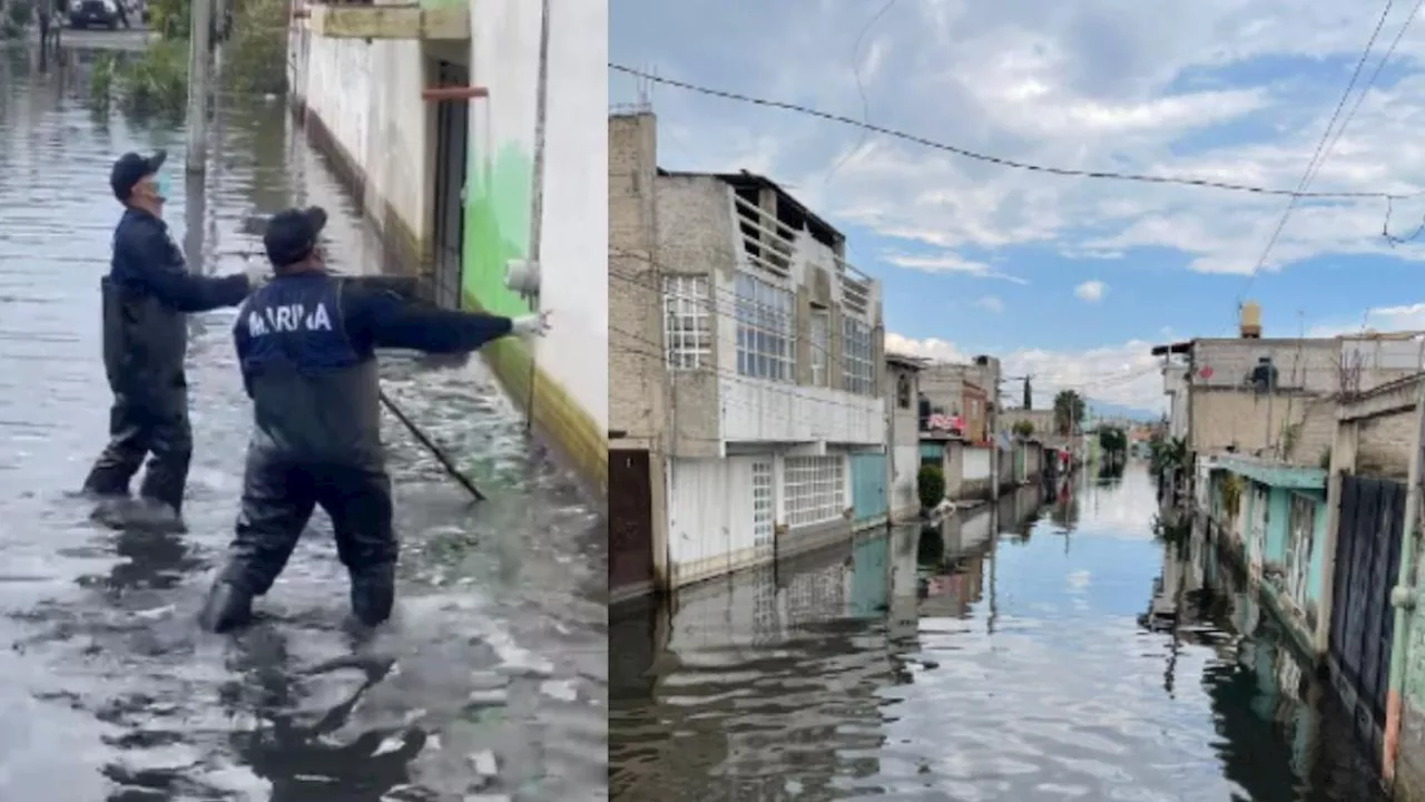 En azoteas, ventanas y calles, vecinos de Chalco piden ayuda, tras las inundaciones que sufrieron