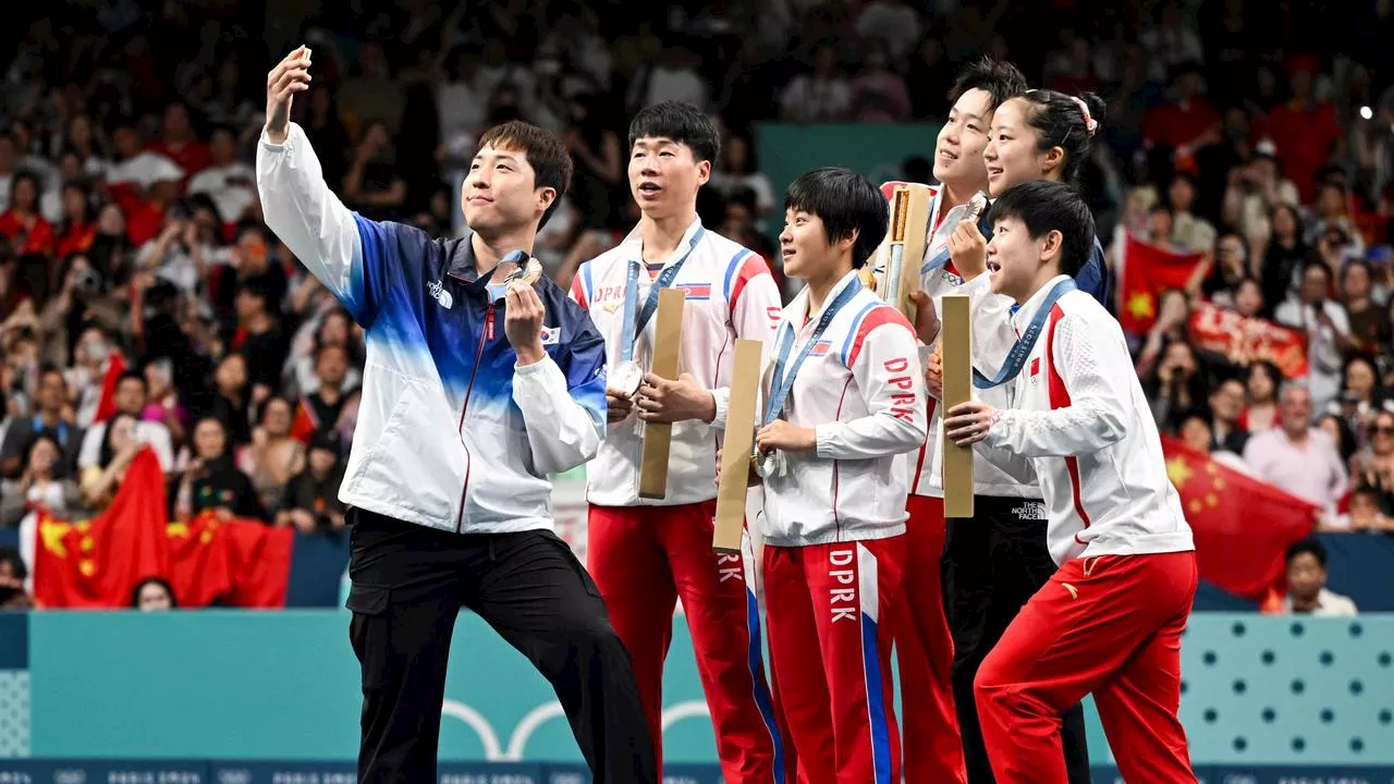 North Korean athletes face punishment over Olympic photo