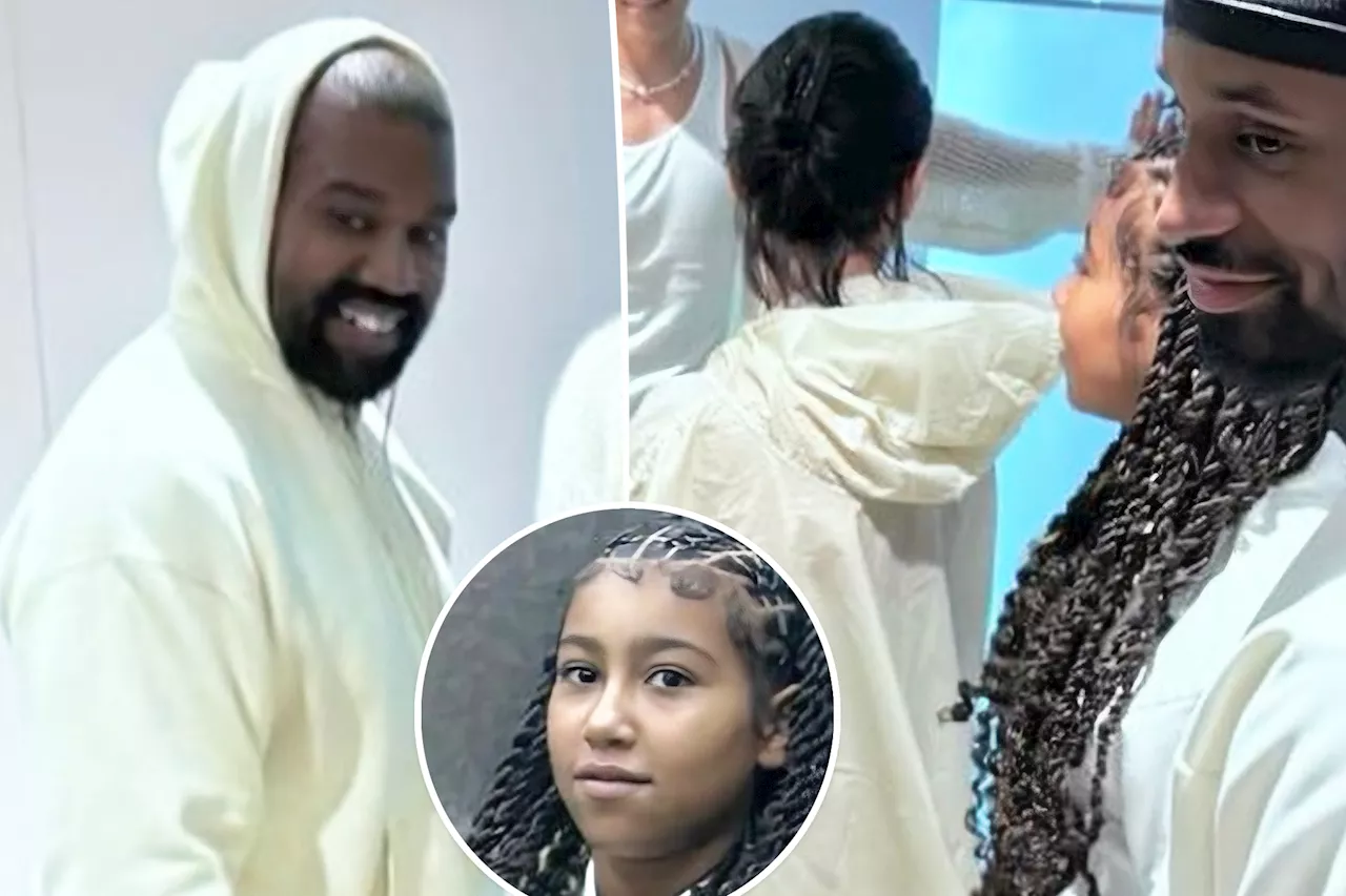 Bianca Censori covers up in flowy cape during shopping trip with Kanye West and stepdaughter North, 11, in Korea