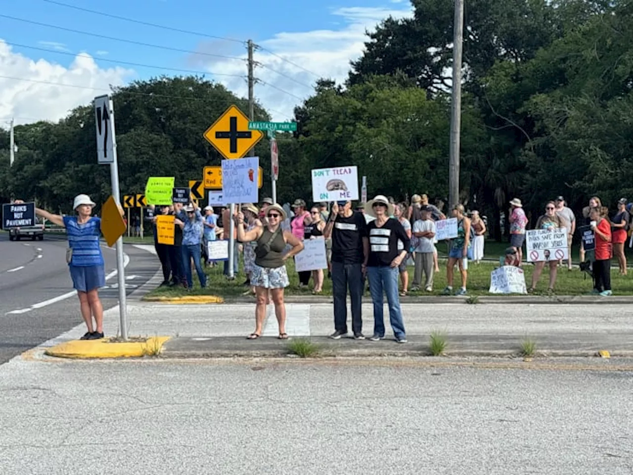 Dozens of community members protest against proposed development at Anastasia State Park