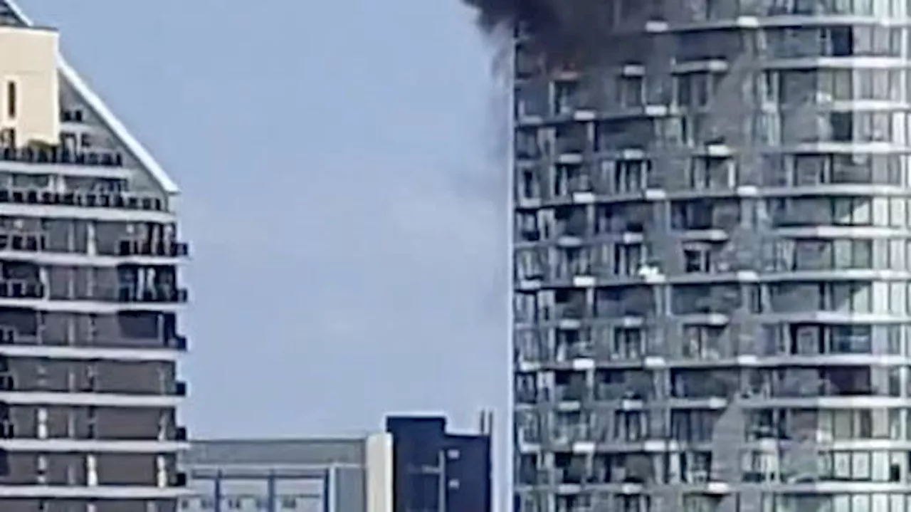 Fire crews leave the scene of second apartment block fire at Canary Wharf, hours after earlier fire in...