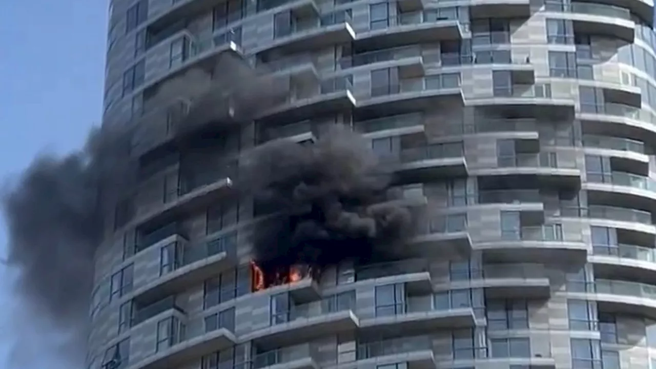 Dozens of firefighters tackle tower block blaze in Blackwall east London