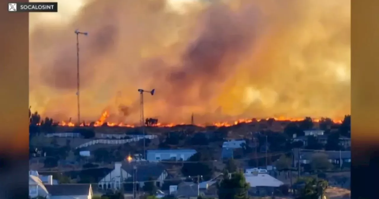 Wind-fueled brush fire briefly threatens homes in San Bernardino County