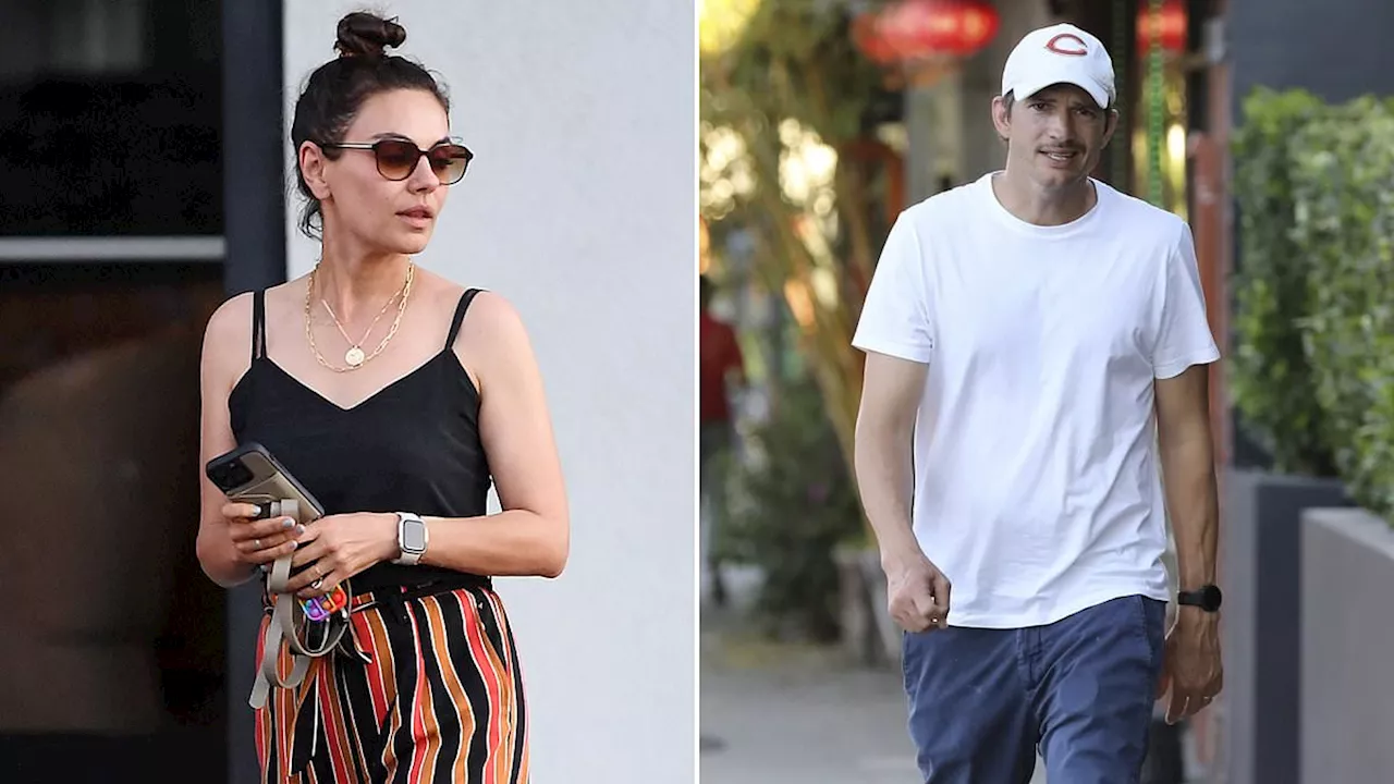 Ashton Kutcher dresses down in a cap and T-shirt as wife Mila Kunis looks chic for a dinner date in...