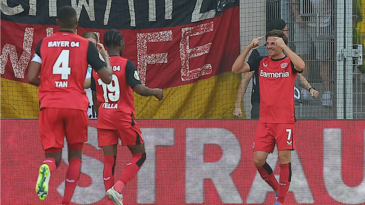  Titelverteidiger Leverkusen müht sich in Runde zwei