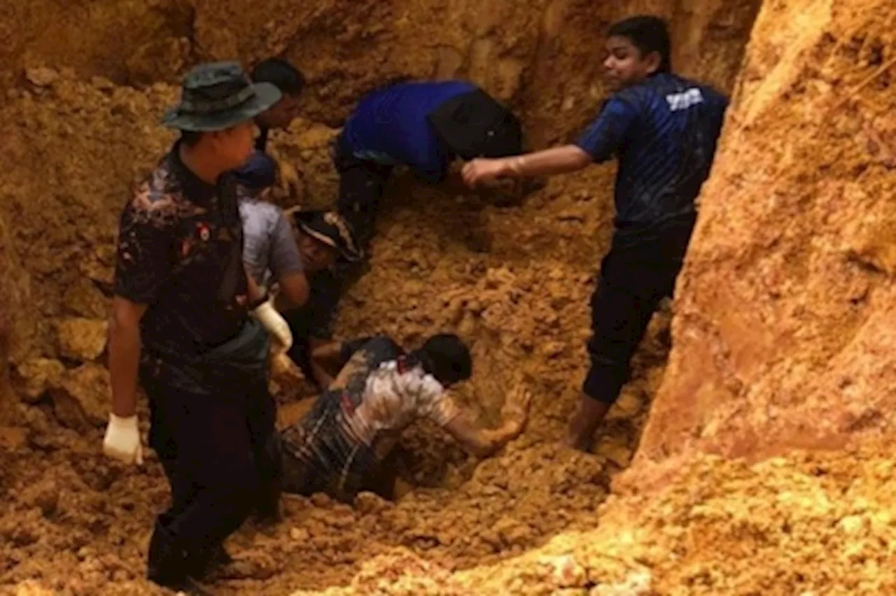 Two policemen buried in landslide while disposing of old bomb in Kluang now stable