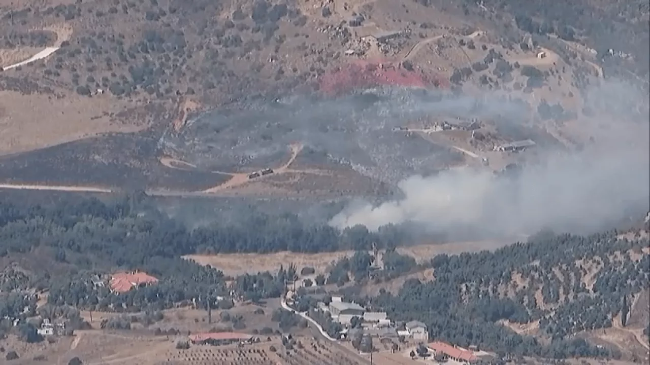 Firefighters stop forward rate of Valley Center brush fire, evacuation warning issued for some areas