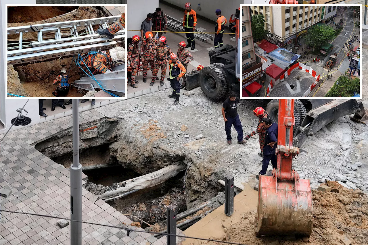 Terrifying moment tourist falls 26 feet into sinkhole in Malaysia: video