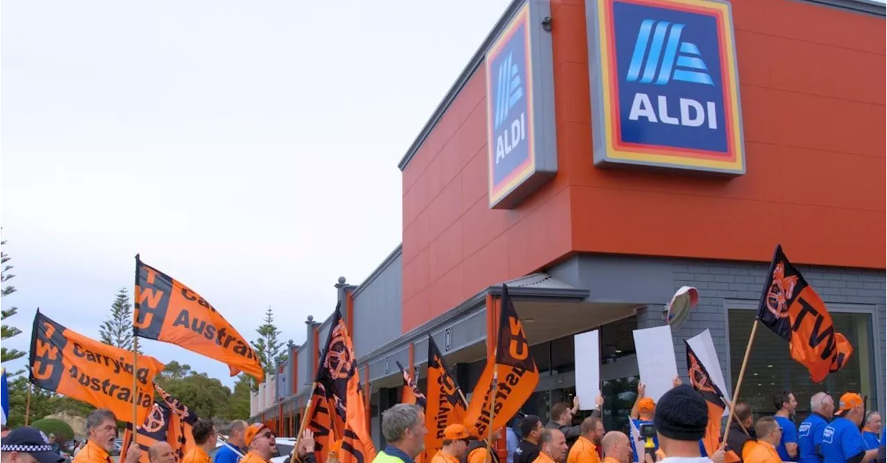 Transport Worker Union members protest outside Aldi headquarters in Sydney