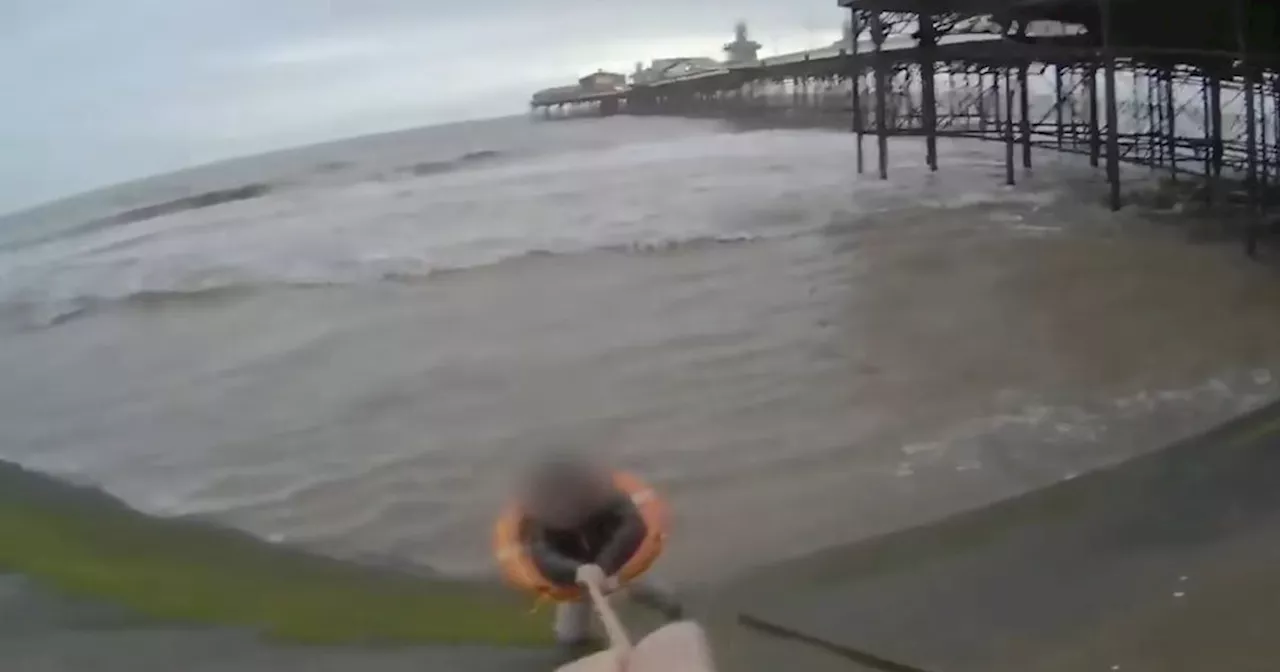 Dramatic moment 'hero' police officer races to save woman from Blackpool sea