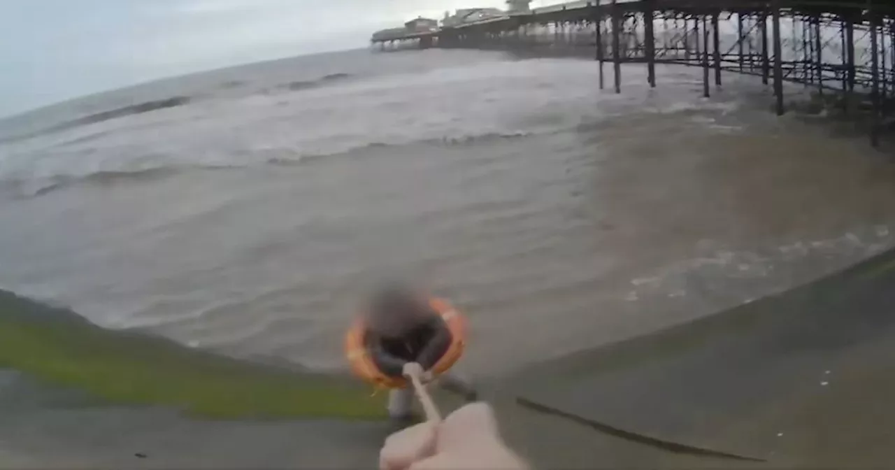 Dramatic moment 'hero' police officer pulls woman from Blackpool sea